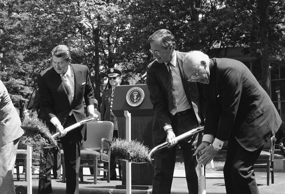 President Ronald Regan, left, with Vice President George Bush and CIA Director William Casey, right, turn the earth on Thursday, May 24, 1984 in McLean, Va., at a groundbreaking ceremony for a new building at the headquarters of the Central Intelligence Agency. (AP Photo/Ron Edmonds)