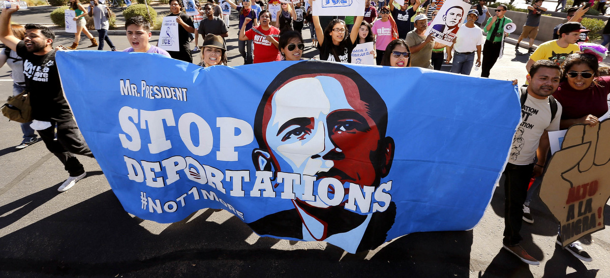Upset with President Barack Obama's immigration policy, about 250 people march to the U.S. Immigrations and Customs Enforcement office with a goal of stopping future deportations on Monday Oct. 14, 2013, in Phoenix. The protesters chanted "no more deportations" and "shut down ICE." (AP/Ross D. Franklin)