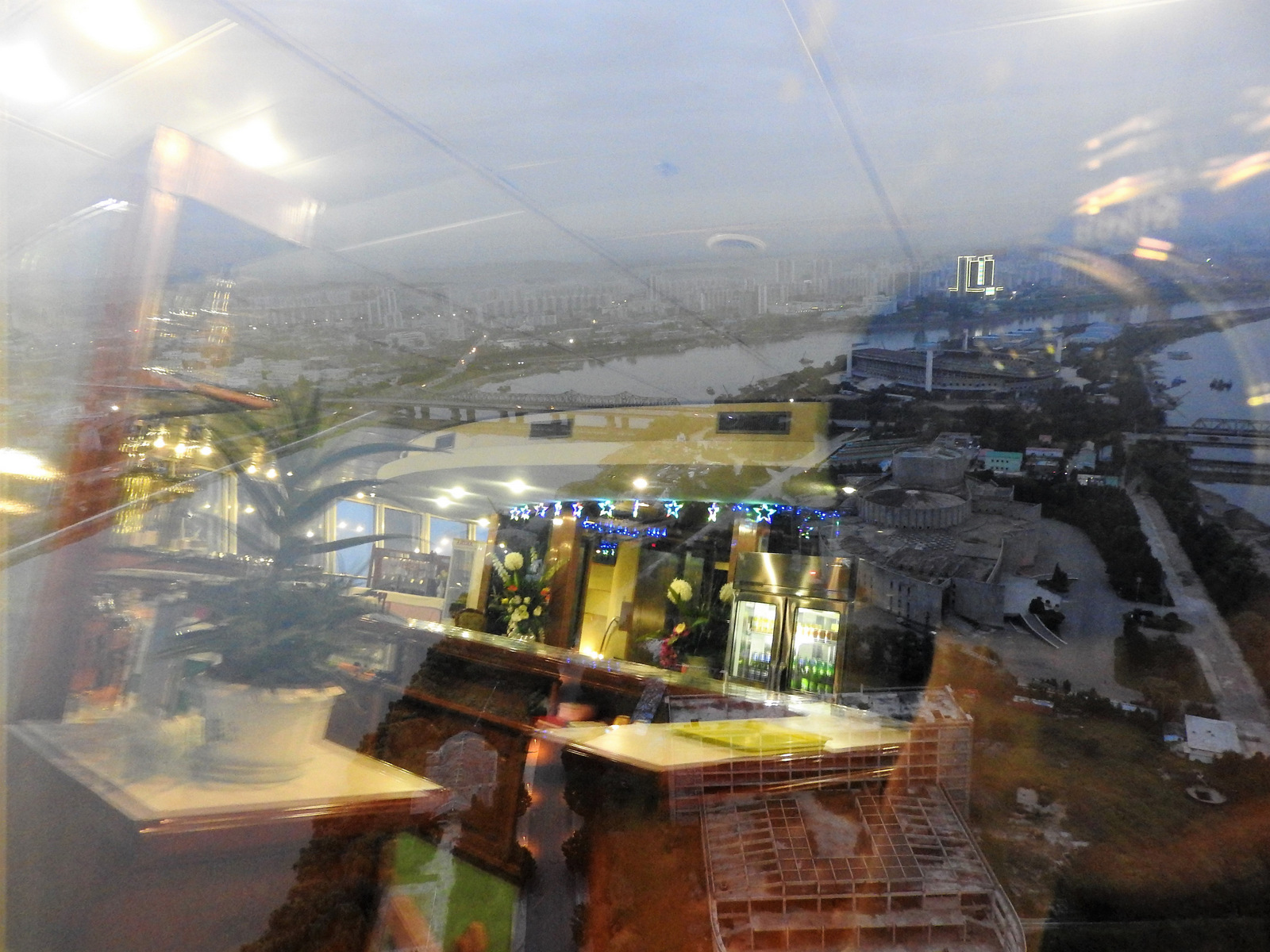 A revolving bar and restaurant at the top of Yanggakdo Hotel overlooks a modern, rebuilt city. The DPRK receives tourists from around the world -- especially China and Japan, but also South Koreans -- and is continually opening up areas for tourism. The potential for more American tourism was recently stymied with the September 1, 2017 U.S. travel ban.