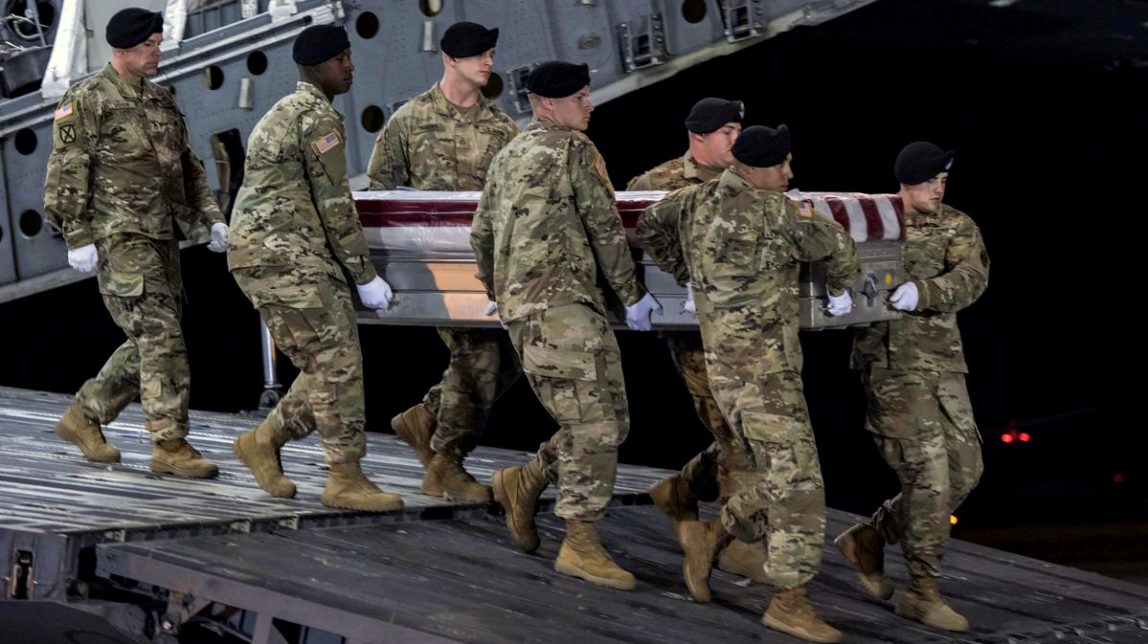 In this image provided by the U.S. Army, a carry team of soldiers from the 3d U.S. Infantry Regiment (The Old Guard), carry the transfer case during a casualty return for Staff Sgt. Dustin M. Wright, of Lyons, Ga., at Dover Air Force Base, Del., Oct. 5, 2017. U.S. and Niger forces were ambushed on Oct. 4 and Wright and three other soldiers were killed. (Pfc. Lane Hiser/U.S. Army via AP)