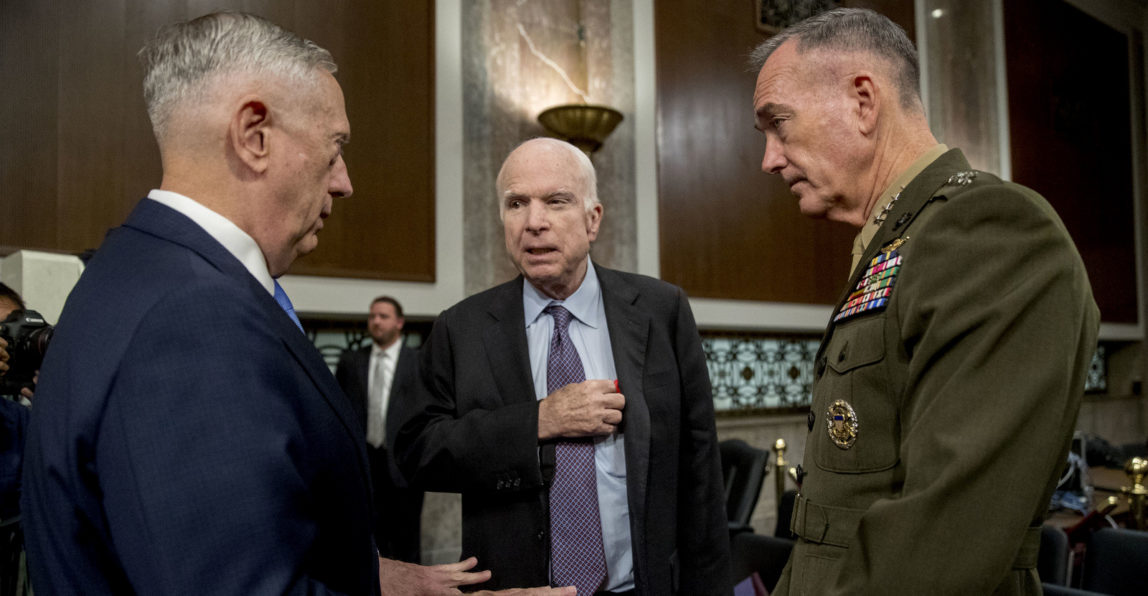 Defense Secretary Jim Mattis, left, and Joint Chiefs Chairman Gen. Joseph Dunford, right, speak with Chairman Sen. John McCain, R-Ariz., center, as they arrive to testify on Afghanistan before the Senate Armed Services Committee on Capitol Hill in Washington,, Oct. 3, 2017. (AP/Andrew Harnik)
