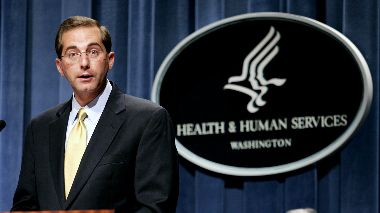 Deputy Health and Human Services Secretary Alex Azar meets reporters at the HHS Department in Washington, Thursday, June 8, 2006. (AP Photo/Evan Vucci)