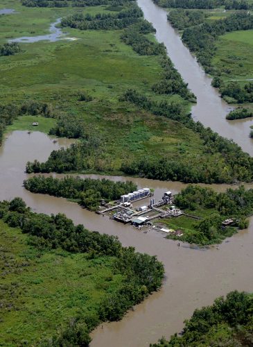 An oil facility is seen in the middle of canals dug for oil pipelines on the coast of Louisiana, Wednesday, July 28, 2010. (AP/Patrick Semansky)