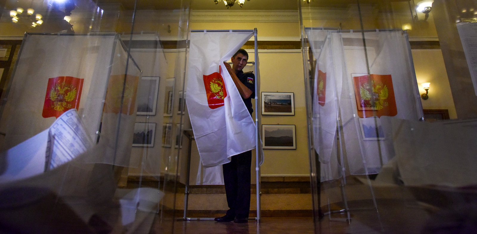 A Russian Black Sea fleet sailor leaves a polling booth to cast his ballot at a polling station during a Russian parliamentary elections in Sevastopol, Crimea, Sept. 18, 2016. (AP Photo/Maxin Voronov)