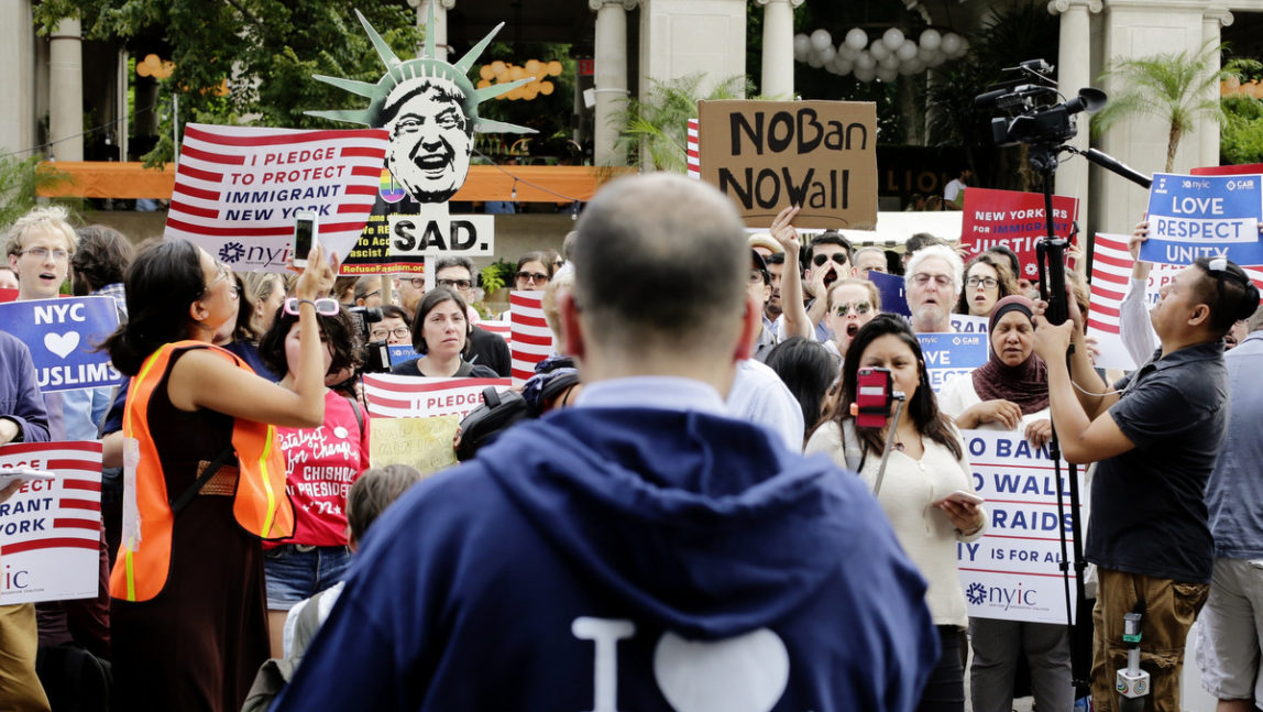 Protestors of a travel ban gather in Union Square, Thursday, June 29, 2017, in New York. A scaled-back version of President Donald Trump's travel ban takes effect Thursday evening, stripped of provisions that brought protests and chaos at airports worldwide in January yet still likely to generate a new round of court fights. (AP Photo/Frank Franklin II)