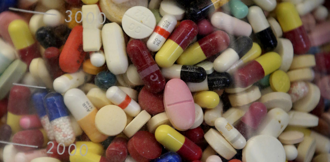 Seized prescription drugs displayed in a glass flask in the controlled substance room of the Utah state crime lab in Taylorsville, Utah. (AP/Rick Bowmer)