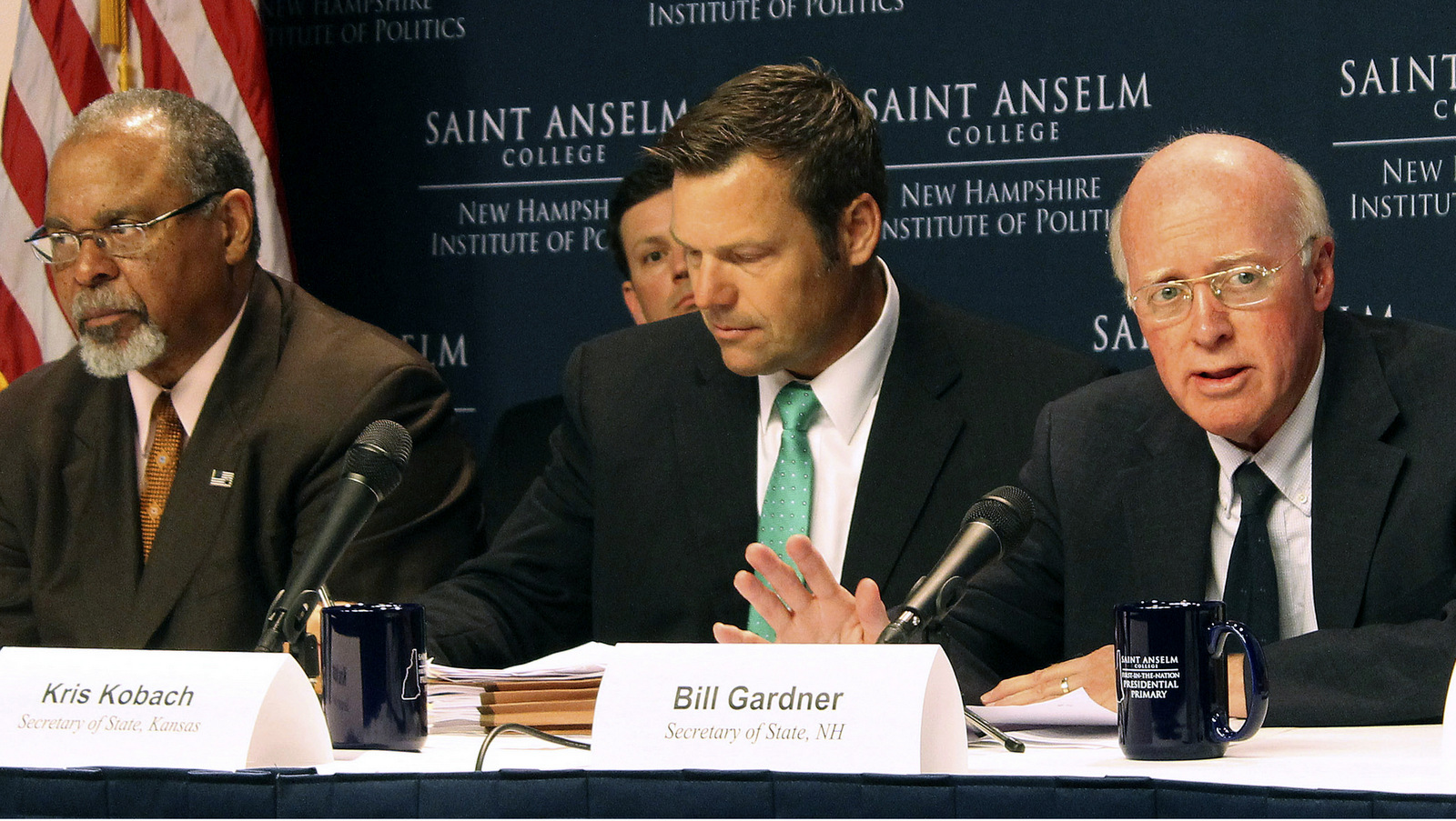 New Hampshire Secretary of State Bill Gardner, right, introduces one of the speakers at a meeting of the Presidential Advisory Commission on Election Integrity on Tuesday, Sept. 12, 2017 in Manchester, NH. Kansas Secretary of State Kris Kobach, center, and former Ohio Secretary of State Ken Blackwell, left, also attend. Gardner opened the meeting by defending his participation and the panel's existence, saying it hasn't yet reached any conclusion. (AP Photo/Holly Ramer)