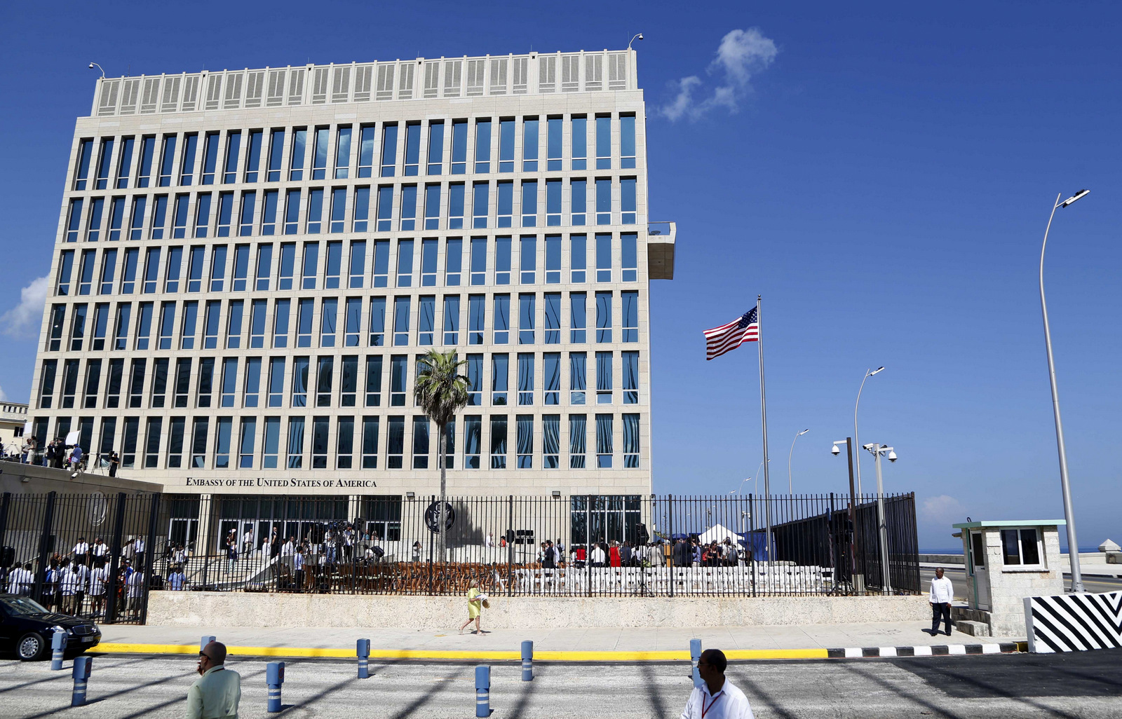 A U.S. flag flies at the U.S. embassy in Havana, Cuba. U.S. investigators are chasing many theories about what’s harming American diplomats in Cuba, including a sonic attack, electromagnetic weapon or flawed spying device. (AP/Desmond Boylan)