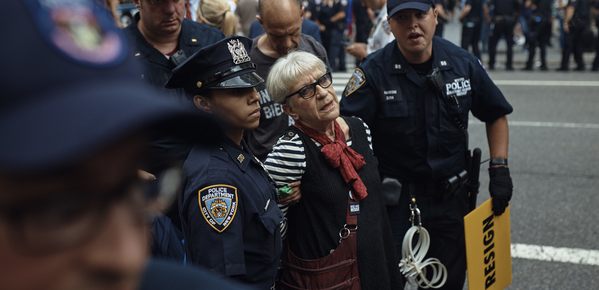 Police arrest a protester during a demonstration against President Donald Trump and his policies in New York, Monday, Sept. 18, 2017. President Trump made his first appearance at the United Nation General Assembly on Monday. (AP Photo/Andres Kudacki)