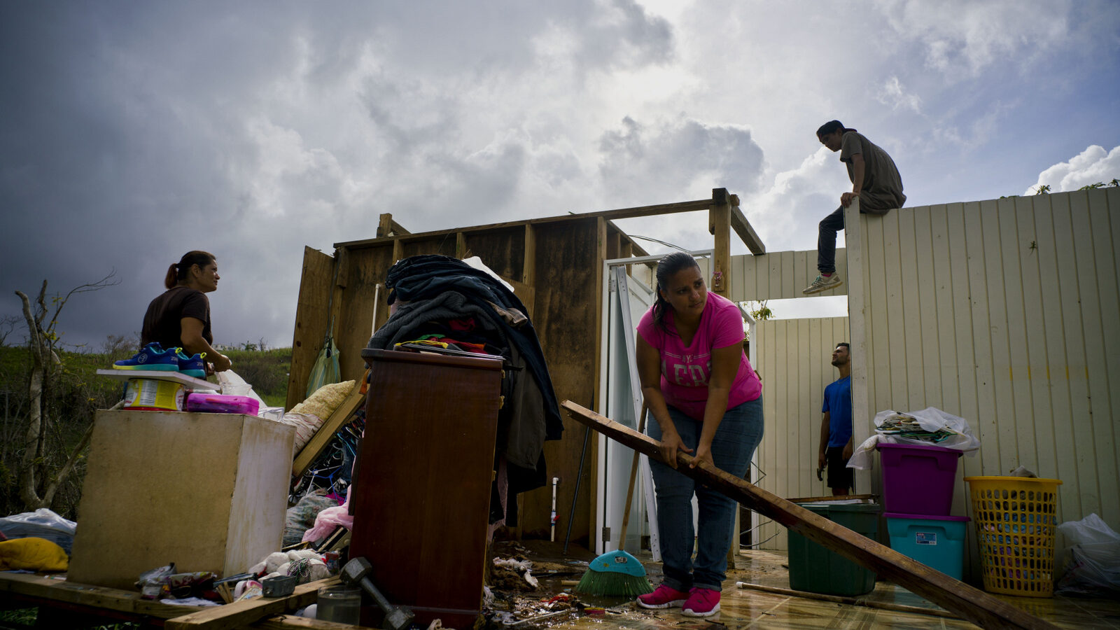People try to recover their belongings and start rebuilding their house that was destroyed by Hurricane Maria, in Morovis, Puerto Rico, Saturday, Oct. 14, 2017. (AP Photo/Ramon Espinosa)