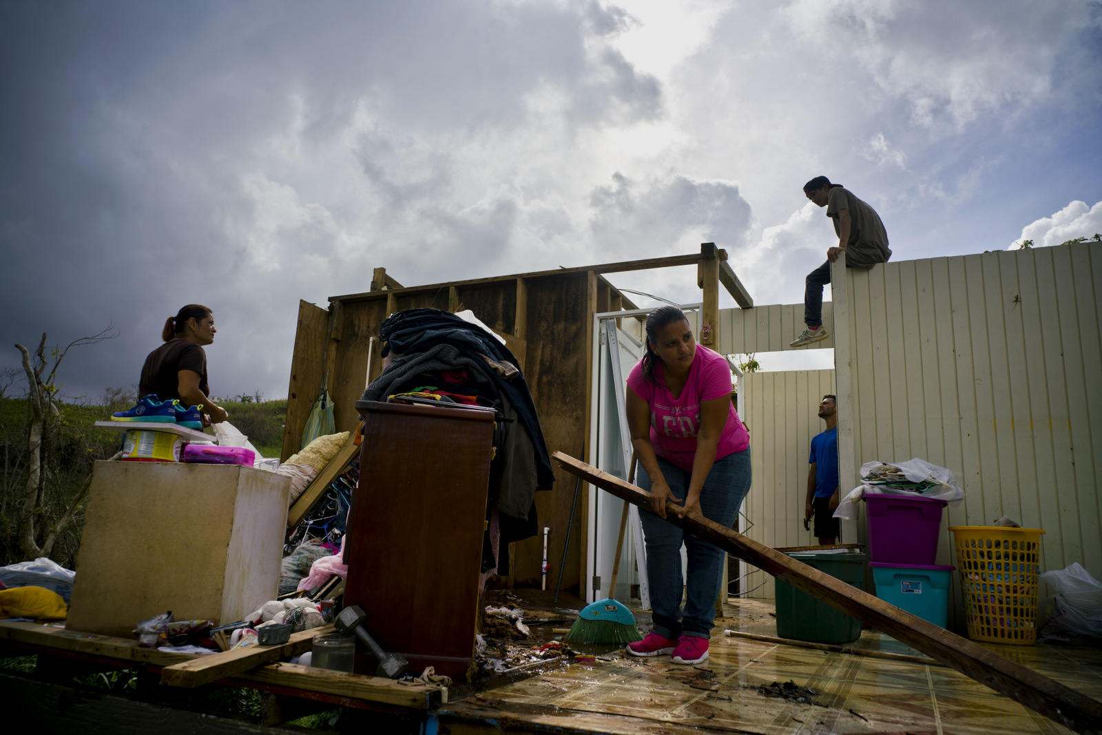 People try to recover their belongings and start rebuilding their house that was destroyed by Hurricane Maria, in Morovis, Puerto Rico, Saturday, Oct. 14, 2017. (AP Photo/Ramon Espinosa)