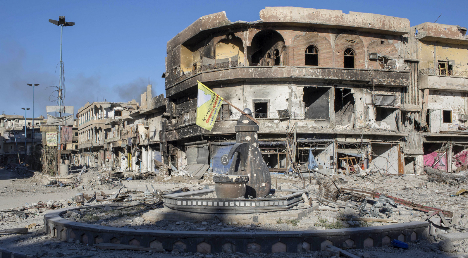 A traffic roundabout in the city of Raqqa, Syria, Wednesday, Oct. 18, 2017. U.S.-backed fighters were removing land mines and clearing roads in the northern city a day after commanders said they had driven ISIS from its de facto capital. (AP/Asmaa Waguih)