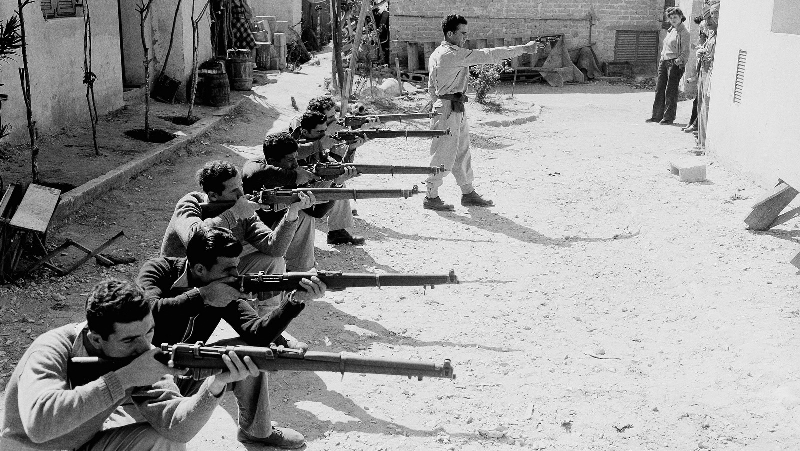 Irgun terrorists receiving training from an instructor near the Jaffa Tel Aviv border in the street on March 4, 1948. (AP/ Jim Pringle)