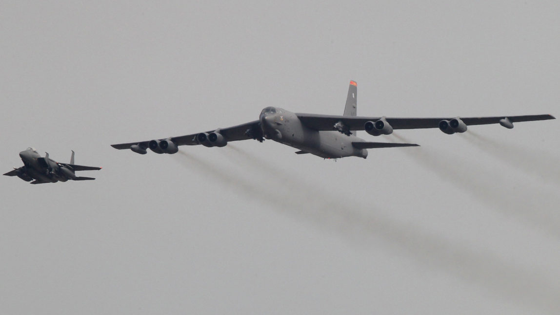 A U.S. Air Force B-52 bomber flies over Osan Air Base in Pyeongtaek, South Korea, Sunday, Jan. 10, 2016. The powerful U.S. B-52 bomber flew low over South Korea recently, a clear show of force from the United States as a Cold War-style standoff deepened between its ally Seoul and North Korea following Pyongyang's fourth nuclear test. (AP/Ahn Young-joon)