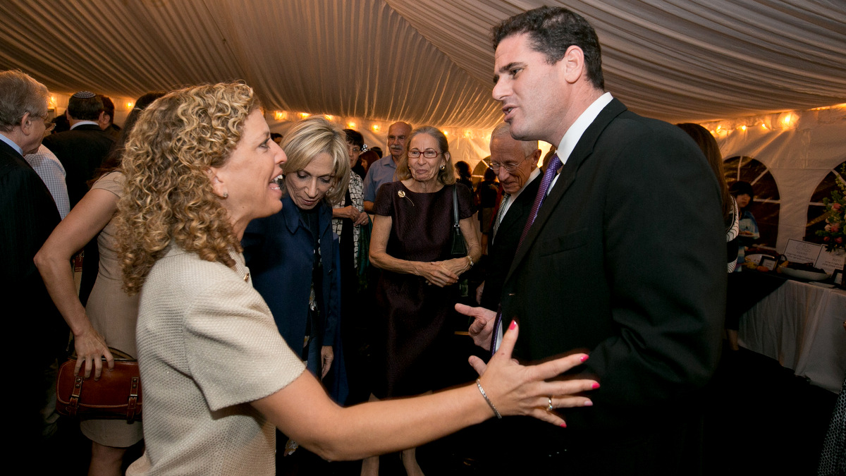Ron Dermer and Debbie Wasserman Schultz at 2014 Israel Embassy Rosh Hashanah event; Dermer also warned about Iran at that event.