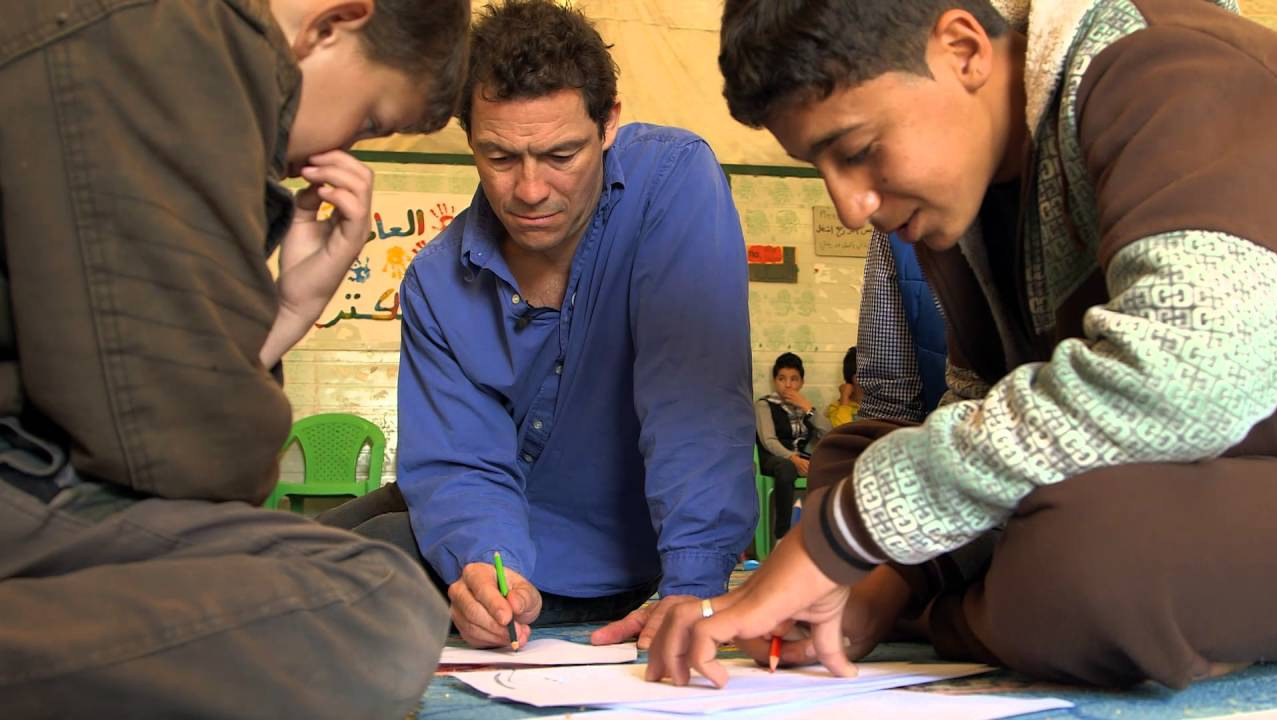 Dominic West with young Syrian refugees during a visit to Za’atari refugee camp in Mafraq, Jordan. (Photo: Save the Children)