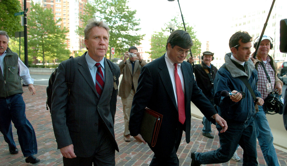 Larry Franklin, of Kearneysville, W.Va., left, leaves the federal courthouse in Alexandria, Va. after a hearing on Wednesday, May 4, 2005. The FBI arrested Franklin, a Pentagon analyst on a charge alleging he passed classified information about potential attacks against U.S. forces in Iraq to employees of a pro-Israel group. (AP/Kevin Wolf)