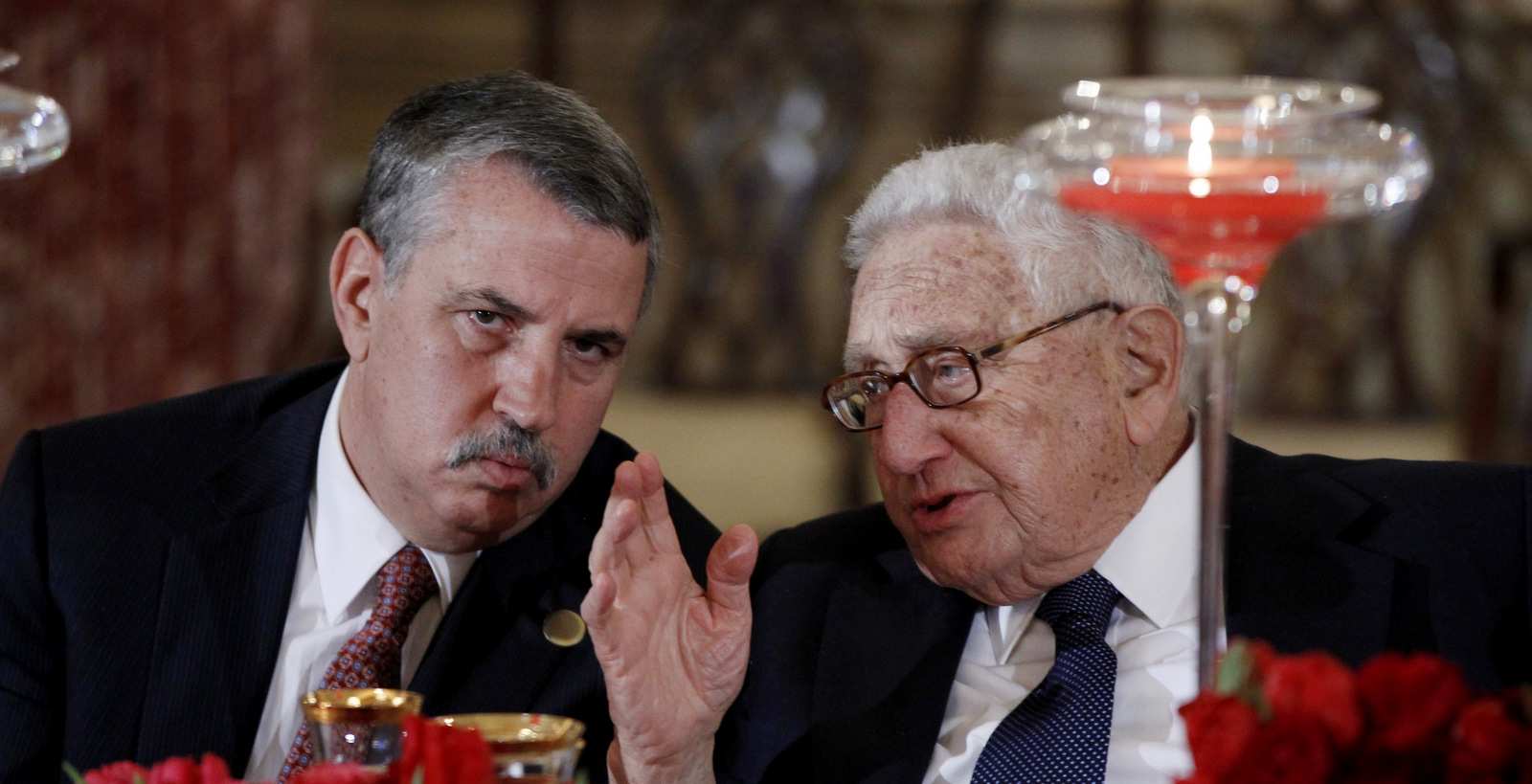 New York Times columnist Thomas L. Friedman, left, talks with former Secretary of State Henry Kissinger during a lunch for Chinese Vice President Xi Jinping, Feb. 14, 2012, at the State Department in Washington. (AP/Charles Dharapak)