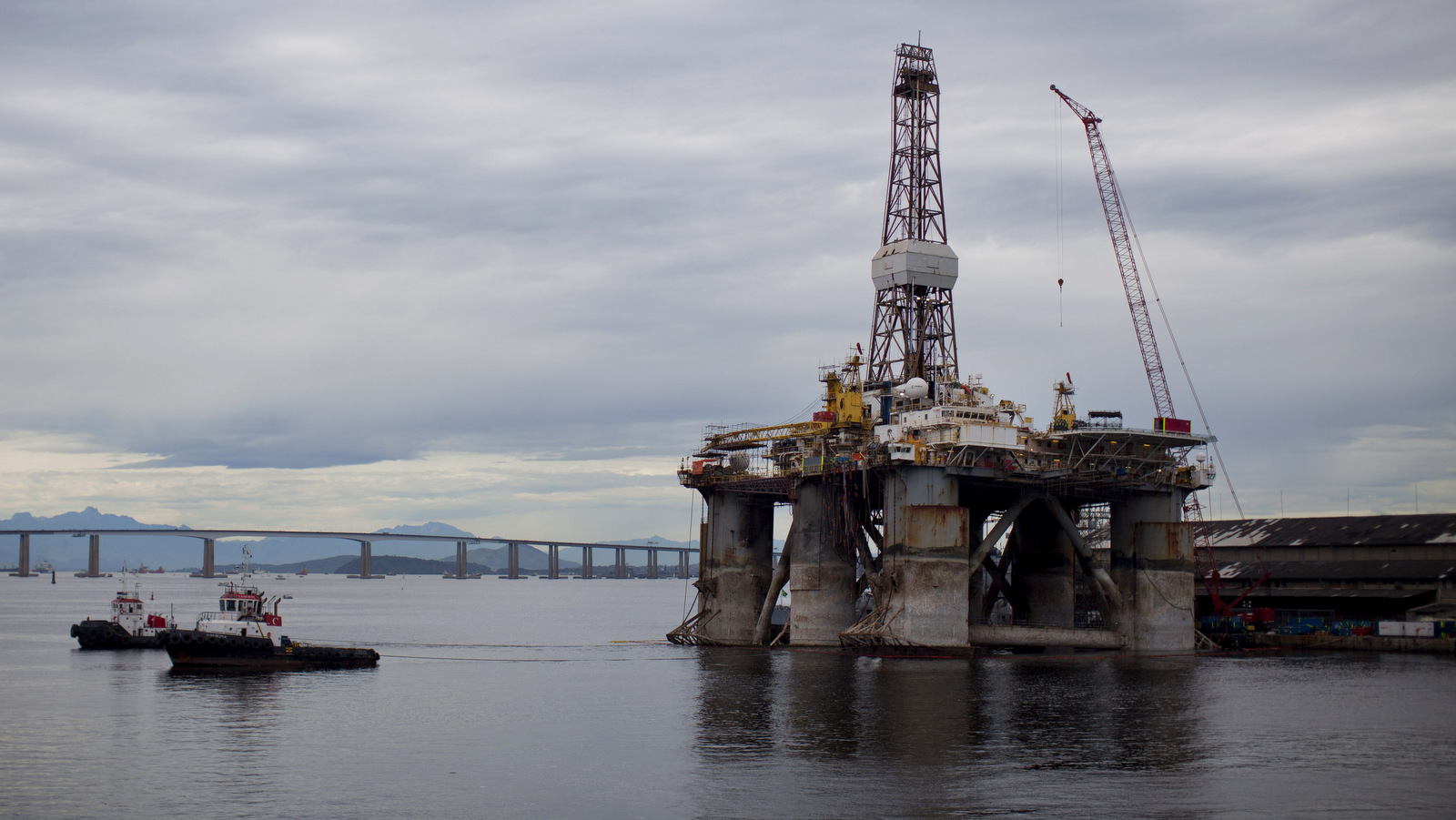 A Transocean Ltd. offshore oil rig is titled to one side in the Guanabara Bay in Rio de Janeiro, Brazil, April 29, 2012. (AP/Felipe Dana)