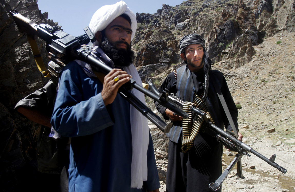 In this Friday, May 27, 2016 photo, members of a breakaway faction of the Taliban fighters prepare to guard a gathering , in Shindand district of Herat province, Afghanistan. (AP/Allauddin Khan)