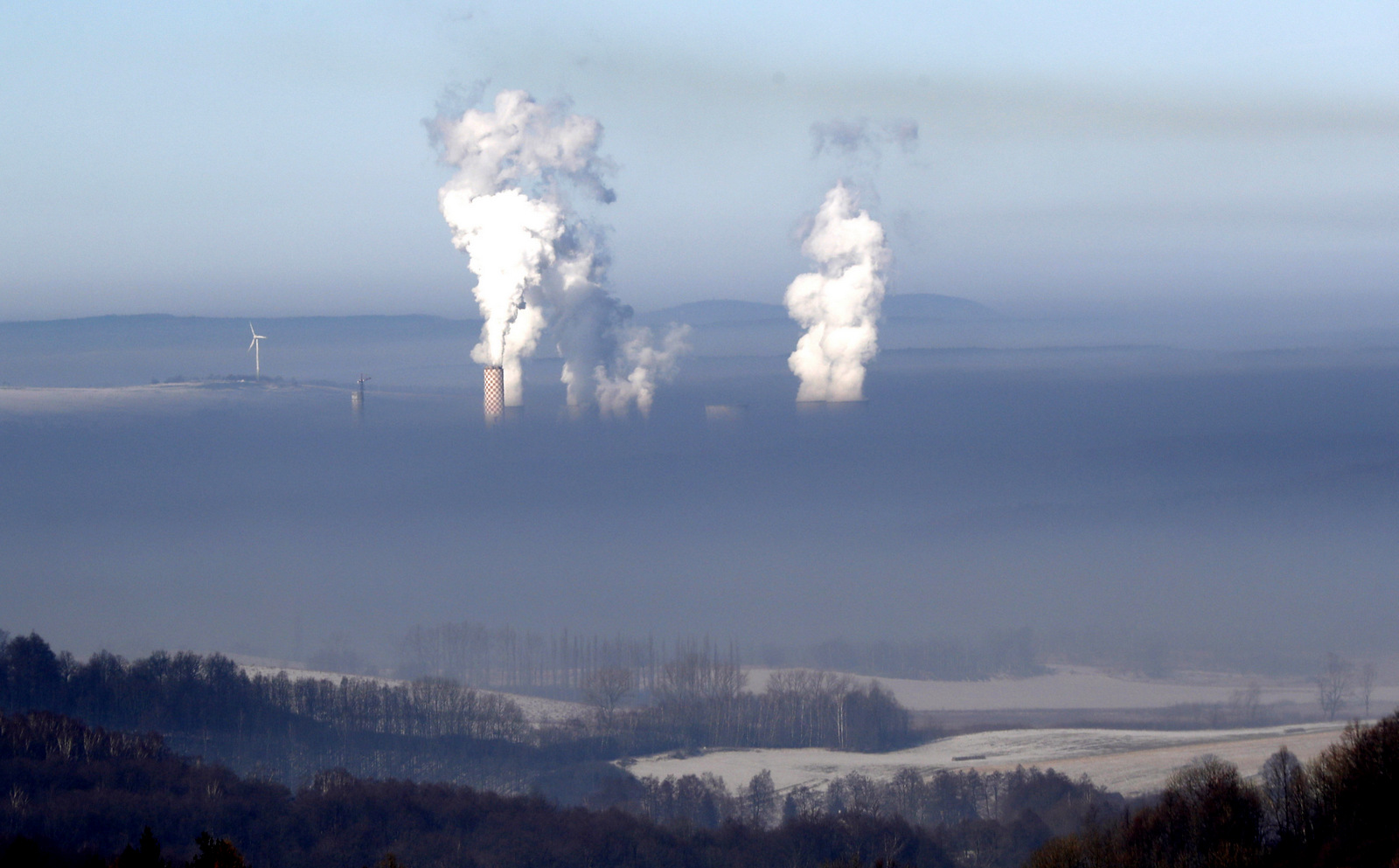 Smoke rises from chimneys of the coal-fired power plant in Bogatynia, Poland. The picture was taken from a hill near the town of Frydlant, Czech Republic, Feb. 14, 2017, as smog across coal-addicted Poland hit crisis levels recently. (AP/Petr David Josek)