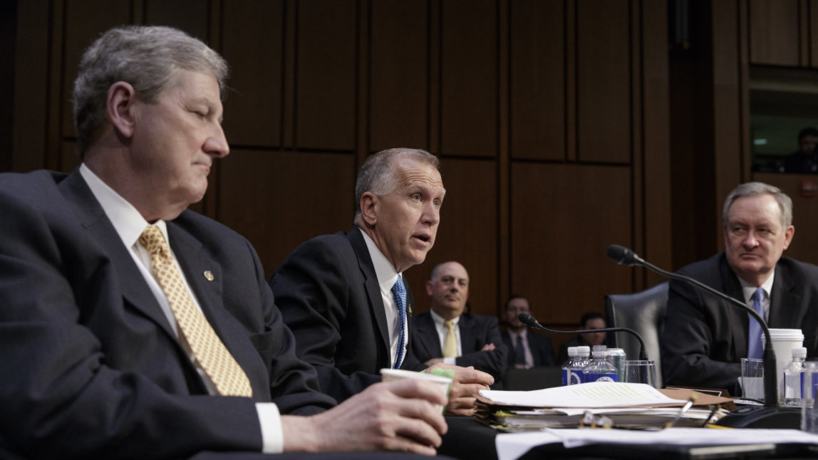 From left, Sen. John Kennedy, R-La., Sen. Thom Tillis, R-N.C., and Sen. Mike Crapo, R-Idaho, GOP members of the Senate Judiciary Committee, work to advance the nomination of President Donald Trump's Supreme Court nominee Neil Gorsuch to fill the vacancy left by the late Antonin Scalia, on Capitol Hill in Washington, Monday, April 3, 2017. A weeklong partisan showdown is expected as Democrats are steadily amassing the votes to block Judge Gorsuch and force Republicans to unilaterally change long-standing rules to confirm him. (AP Photo/J. Scott Applewhite)