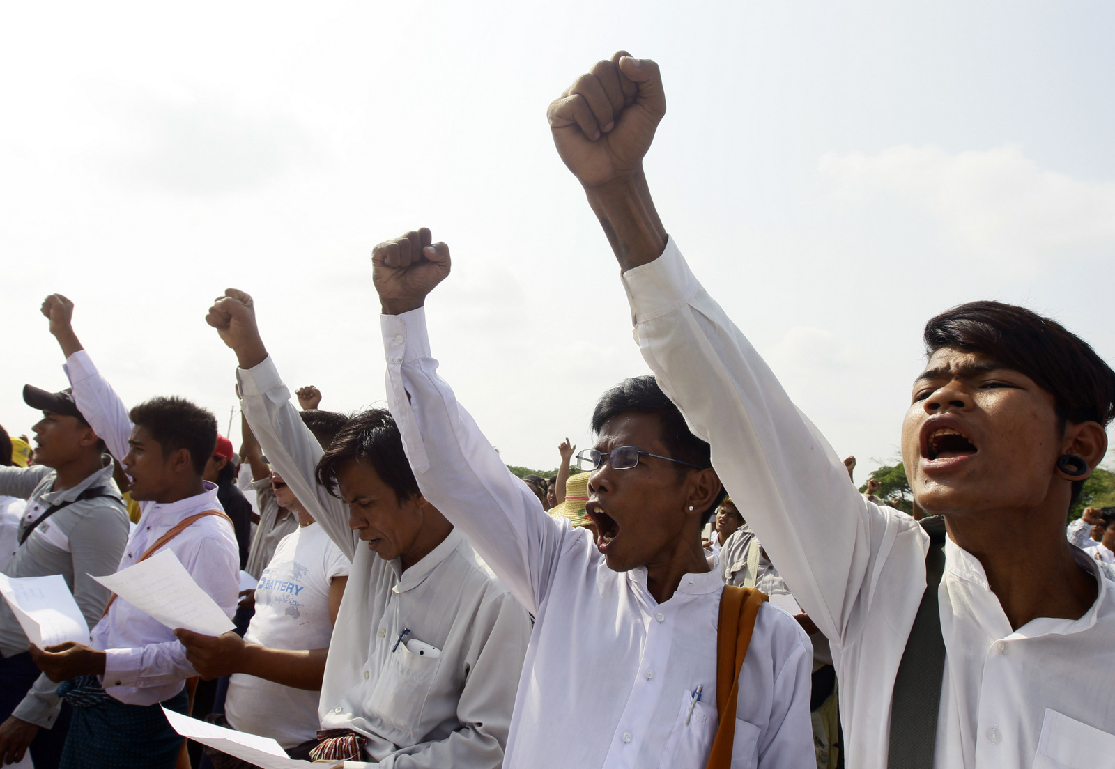 Members of a Myanmar's ultra-nationalist Buddhist group shout slogans during a protest rally in Nayptitaw, Myanmar, Saturday, May 20, 2017, against Religious Minister Thura Aung Ko for his intervention in a case in which Myanmar Now news chief reporter Swe Win leveled allegations against Wirathu, a high-profile leader of the Myanmar Buddhist organization known as Ma Ba Tha, after the monk praised the assassination of prominent Muslim lawyer Ko Ni who was a legal advisor to Aung San Suu Kyi's government. (AP/Aung Shine Oo)