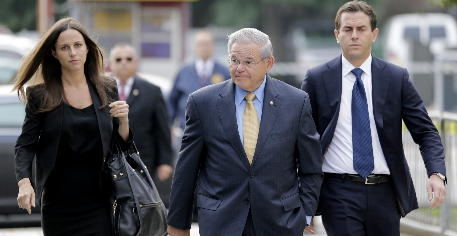 Sen. Bob Menendez, center, arrives with his children, Alicia Menendez and Robert Menendez Jr., to court in Newark, N.J., Sept. 6, 2017. (AP/Seth Wenig)