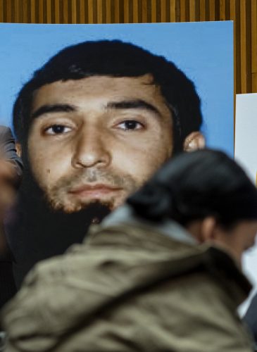A photo of Sayfullo Saipov is displayed at a news conference at One Police Plaza Wednesday, Nov. 1, 2017, in New York. Saipov is accused of driving a truck on a bike path that killed several and injured others Tuesday near One World Trade Center. (AP Photo/Craig Ruttle)