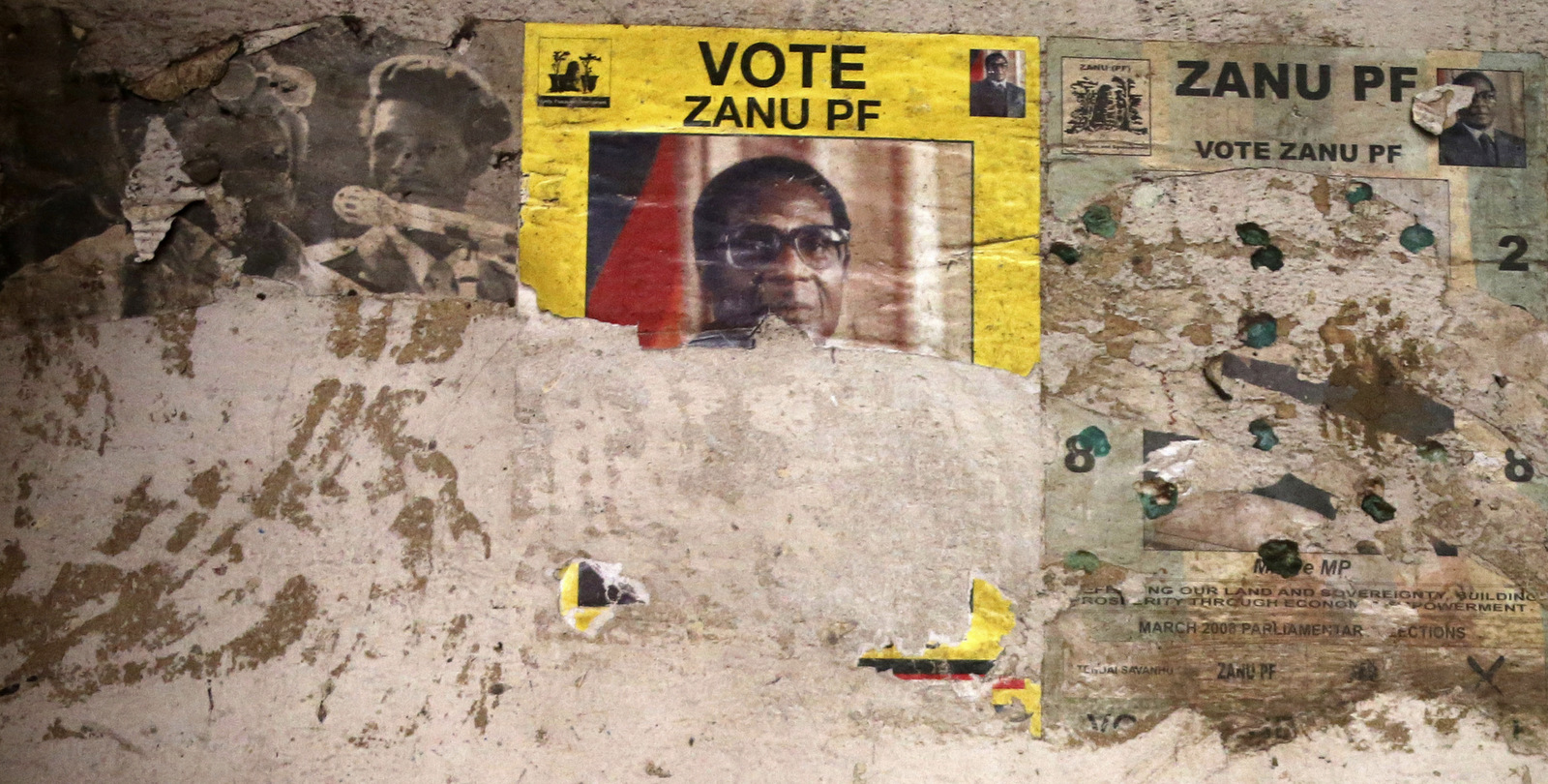 An election poster from the 2008 Zanu Pf election campaign on the wall of a dilapidated old building in the Mbara suburb of Harare, Friday Nov. 17, 2017. Zimbabwe's military says it is making "significant progress" in talks with President Robert Mugabe for his departure while it pursues and arrests some allies of the leader and his wife. (AP Photo)