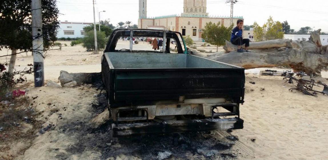 A burned truck is seen outside Al-Rawda Mosque in Bir al-Abd northern Sinai, Egypt a day after attackers killed hundreds of worshippers, on Saturday, Nov. 25, 2017. Friday's assault was Egypt's deadliest attack in the country's modern history, a grim milestone in a long-running fight against an insurgency. (AP/Tarek Samy)
