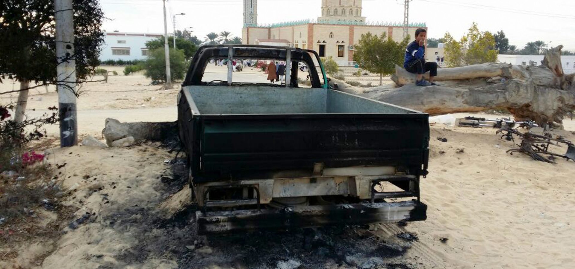 A burned truck is seen outside Al-Rawda Mosque in Bir al-Abd northern Sinai, Egypt a day after attackers killed hundreds of worshippers, on Saturday, Nov. 25, 2017. Friday's assault was Egypt's deadliest attack in the country's modern history, a grim milestone in a long-running fight against an insurgency. (AP/Tarek Samy)