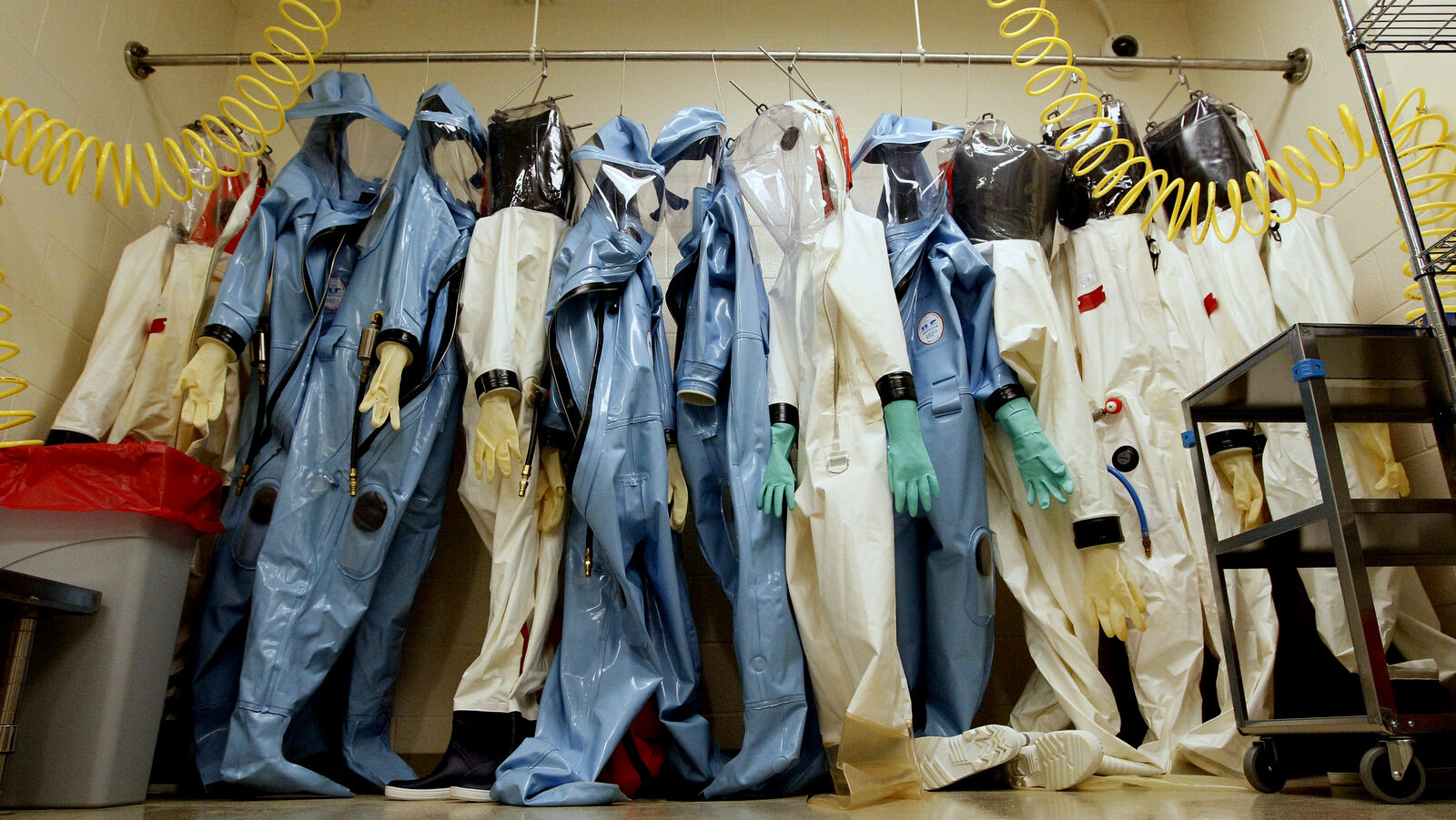 Biohazard suits hang in a Biosafety Level 4 laboratory at the U.S. Army Medical Research Institute of Infectious Diseases at Fort Detrick, Md. (AP/Patrick Semansky)