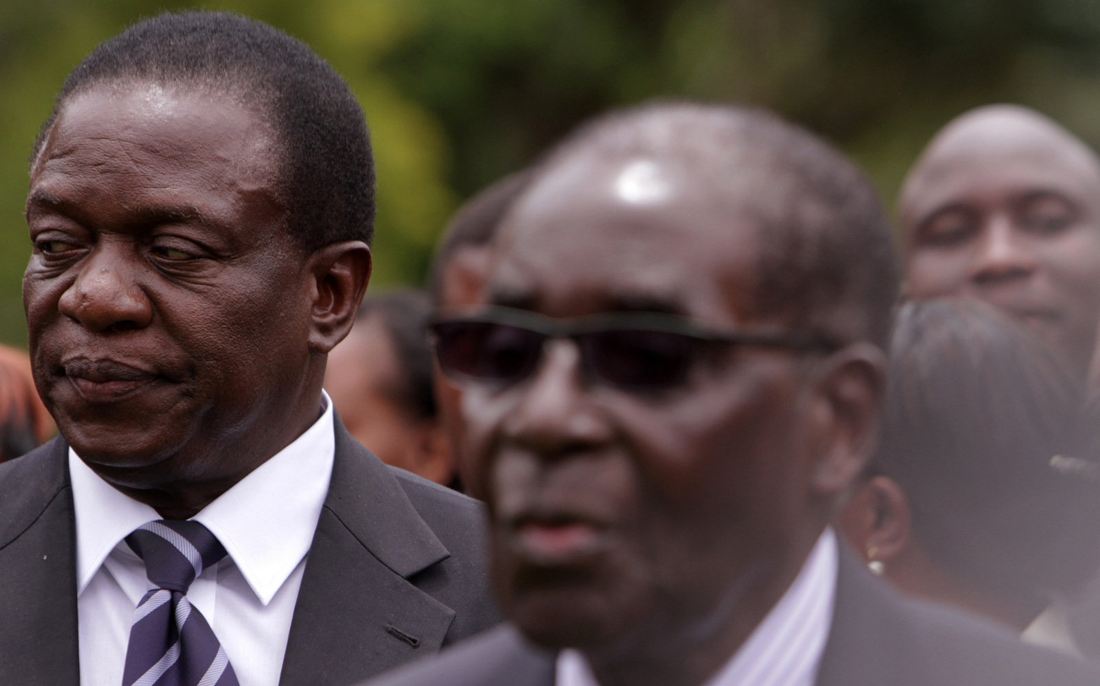 Emmerson Mnangagwa, left, Vice President of Zimbabwe stands next to Zimbabwean President Robert Mugabe after the swearing in ceremony at State House in Harare, Dec, 12, 2014. (AP/Tsvangirayi Mukwazhi)