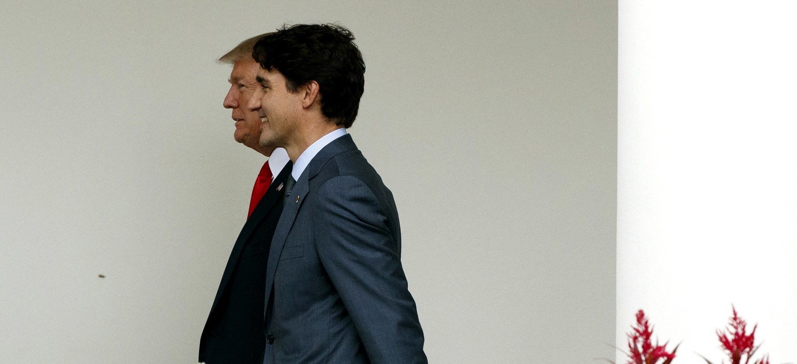 President Donald Trump walks with Canadian Prime Minister Justin Trudeau along the Colonnade to the Oval Office at the White House on Oct. 11, 2017. (AP Photo)