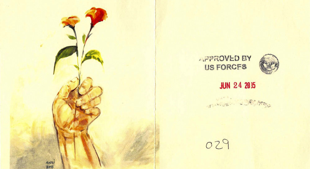 Muhammad Ansi, Hand Holding Red Flowers, 2015 (color photocopy of original and reverse, showing stamps indicating approval for release from Guantánamo).