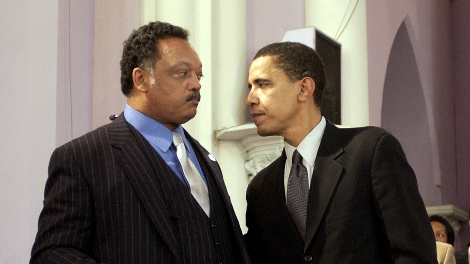 Barack Obama, right, chats with the Rev. Jesse Jackson at the Salem Baptist Church, March 14, 2004, in Chicago. Barack was at the church to speak to supporters before the upcoming elections. (AP/Steve Matteo)