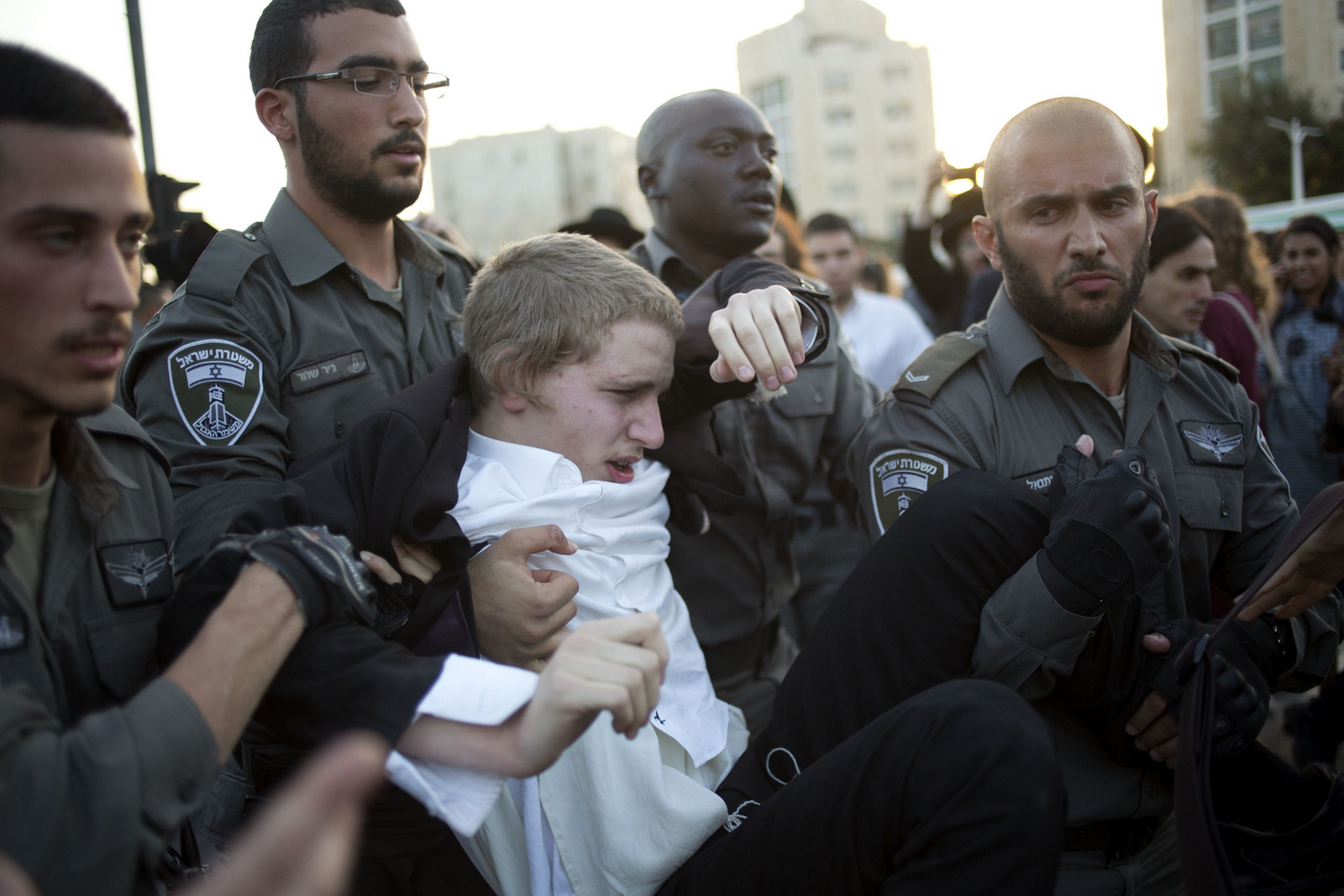 Israeli Police officers arrest an ultra-Orthodox Jew during a protest against Israeli army conscription, in Jerusalem, Oct. 19, 2017. (AP/Ariel Schalit)