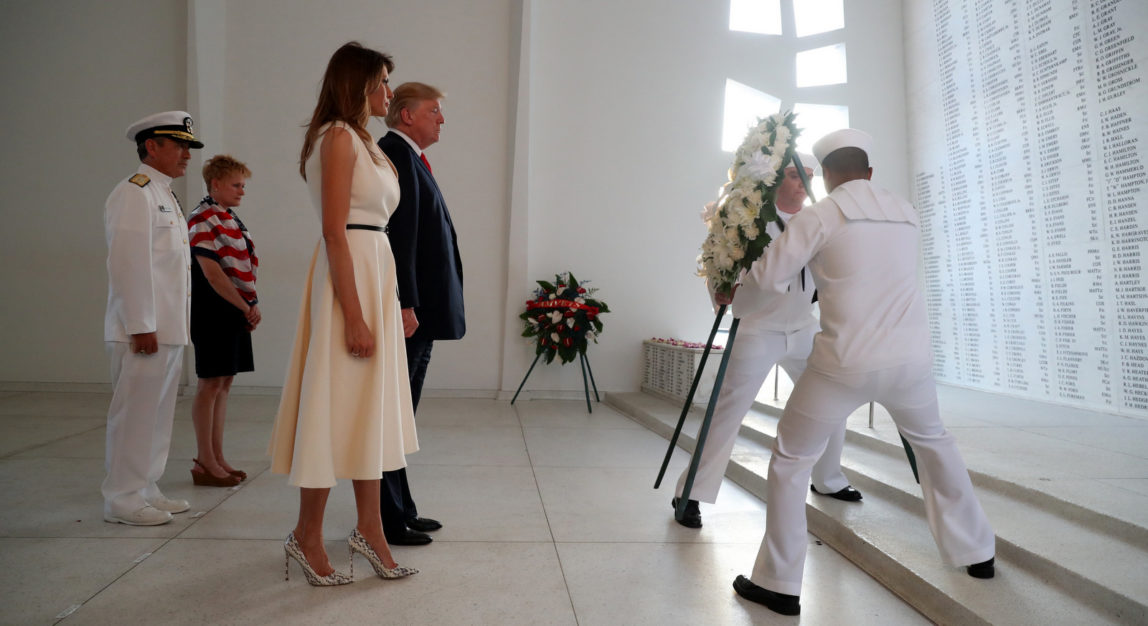 U.S. President Donald Trump and first lady Melania Trump lay a wreath at the USS Arizona Memorial in Pearl Harbor, Honolulu, Hawaii, Nov. 3, 2017. (AP/Andrew Harnik)