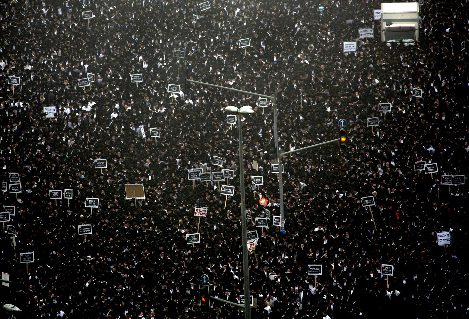 In this March 2, 2014 photo, hundreds of thousands of ultra-Orthodox Jews rally against plans to force them to serve in the Israeli military, blocking roads and paralyzing the city of Jerusalem. (AP/Ariel Schalit)