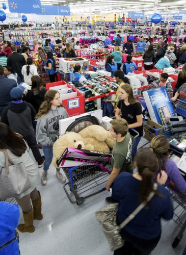 Shoppers scramble to get deals at Walmart on the day before Black Friday, Nov. 23, 2017 in Bentonville, Ark. Gunnar Rathbun | AP