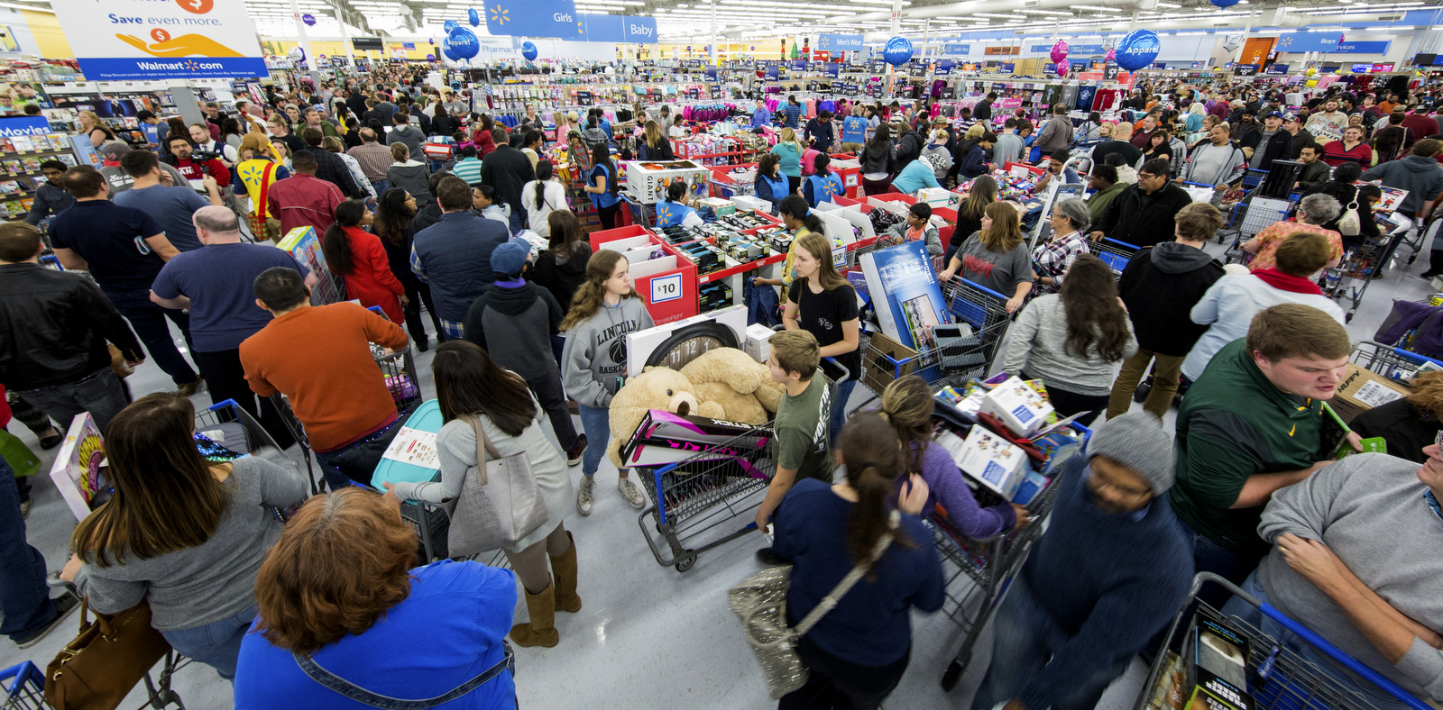 Shoppers scramble to get deals at Walmart on the day before Black Friday, Nov. 23, 2017 in Bentonville, Ark. Gunnar Rathbun | AP