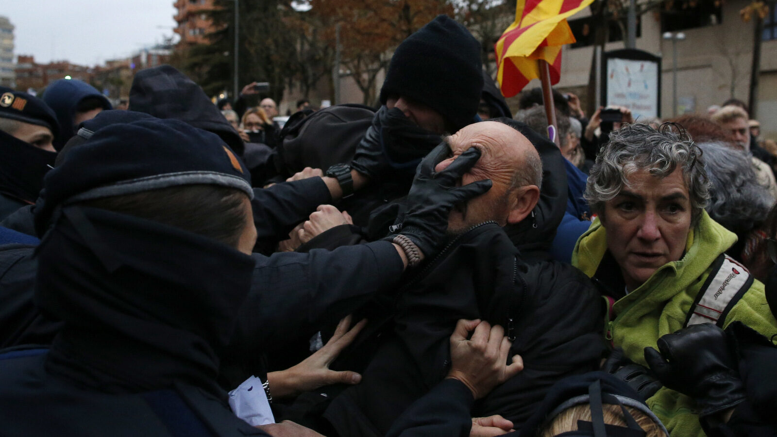 Catalan Mossos d'Esquadra officers scuffle with demonstrators around Lleida museum in the west of Catalonia, Spain, Dec. 11, 2017. Police in Spain's northeastern Catalan city of Lleida have clashed with people protesting a judicial ruling ordering the city's museum to return 44 pieces of religious art to the neighboring regional government of Aragon.(AP/Manu Fernandez)