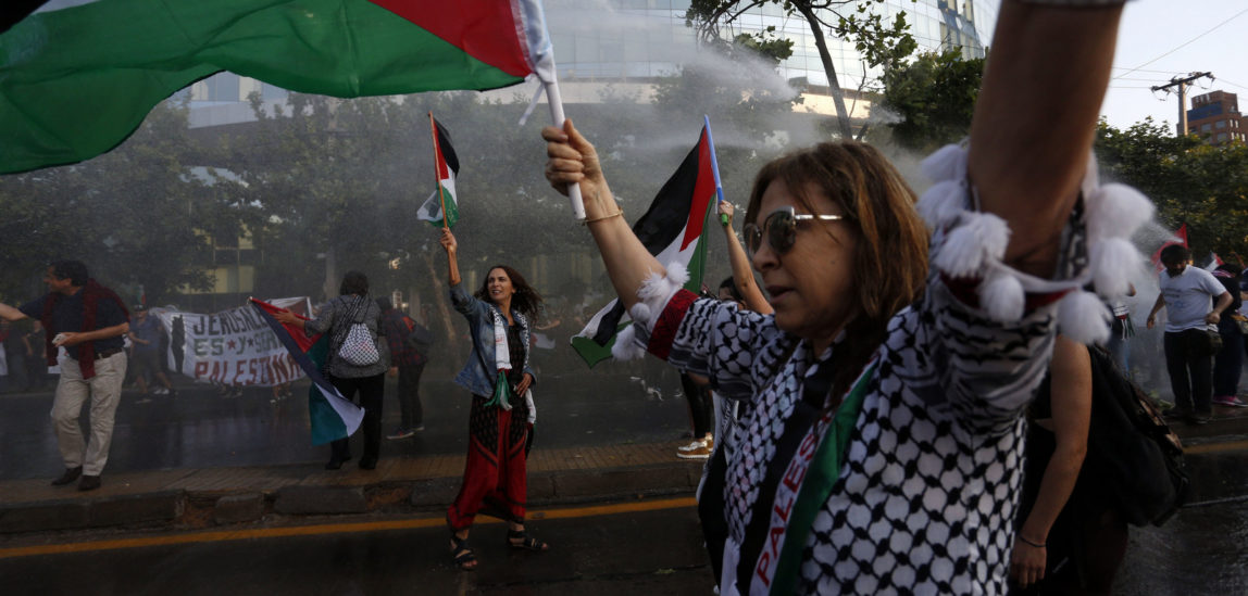 Chileans protest U.S. President Donald Trump's decision to recognize Jerusalem as Israel's capital, outside the U.S. Embassy in Santiago, Chile, Dec. 11, 2017. (AP/Luis Hidalgo)