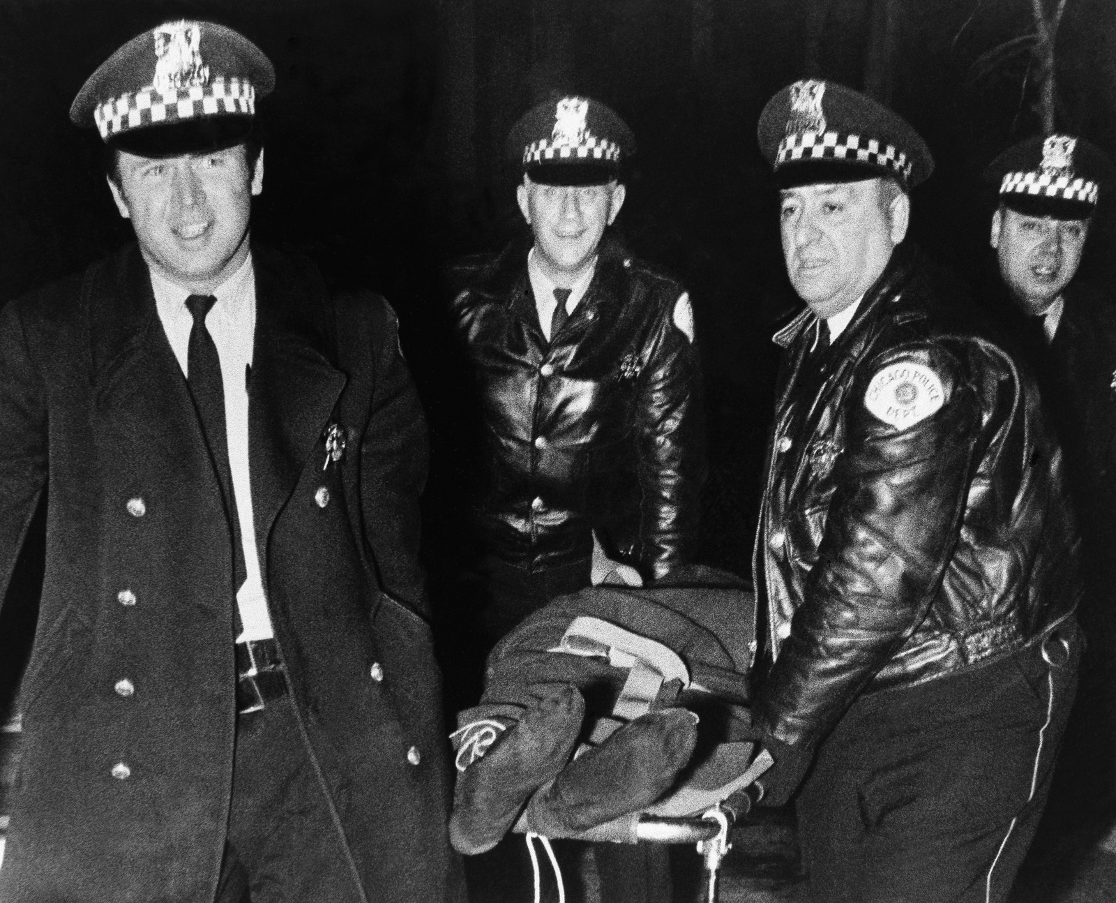 Chicago police remove the body of Fred Hampton, leader of the Illinois Black Panther Party, who was slain by police on Chicago's west side Dec. 4, 1969. (AP Photo)