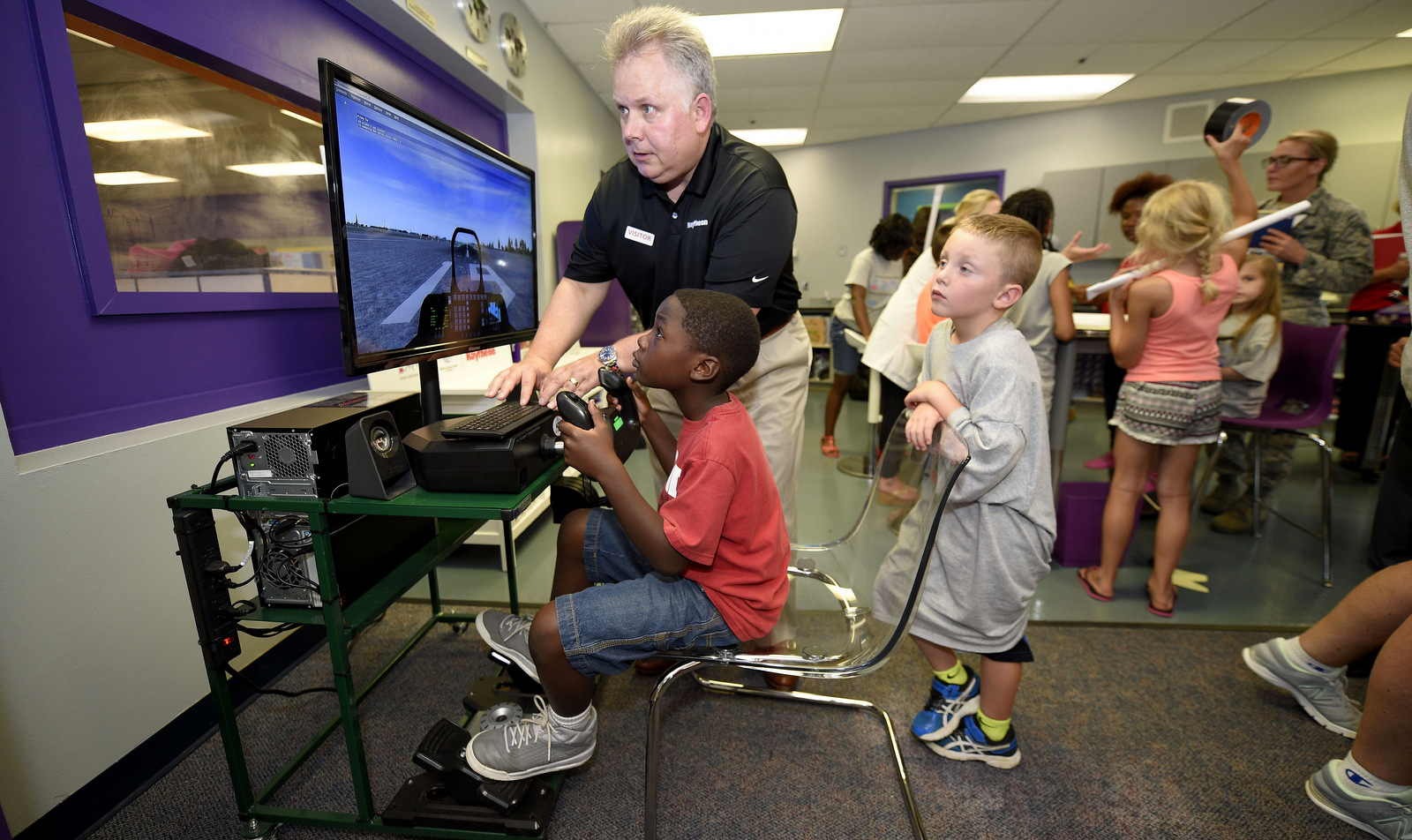 Attendees take part in activities at the Raytheon STEM Centers of Innovation Opening Event,, June 24, 2016, at Joint Base Andrews Youth Center, Md. Boys & Girls Clubs of America in partnership with Raytheon is creating STEM Centers of Innovation at Clubs across the country. (Nick Wass/AP )
