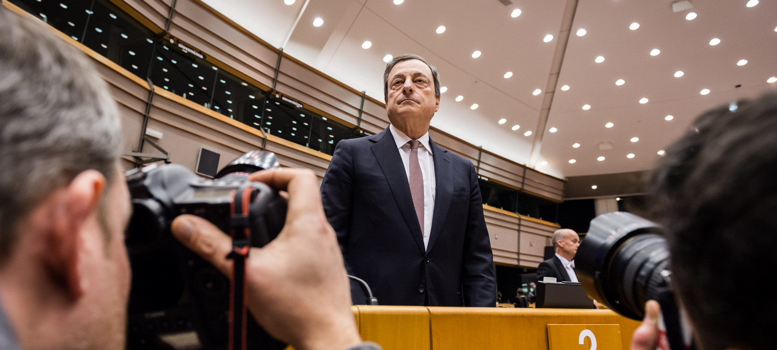 European Central Bank Governor Mario Dragh arrives for a plenary session at the European Parliament in Brussels, Feb. 25, 2015. (AP/Geert Vanden Wijngaert)