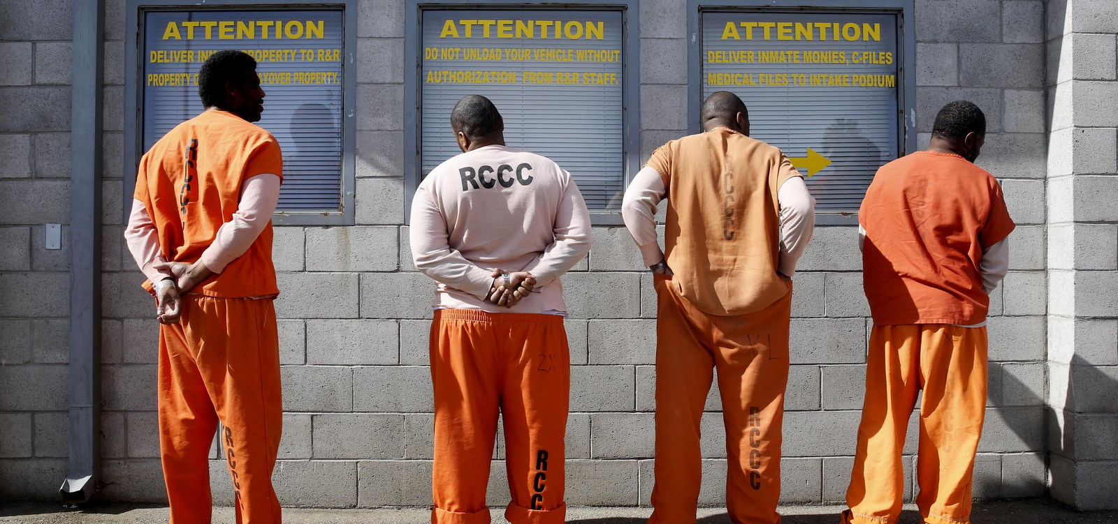 Inmates from Sacramento County await processing after arriving at the Deuel Vocational Institution in Tracy, Calif. (AP Photo)