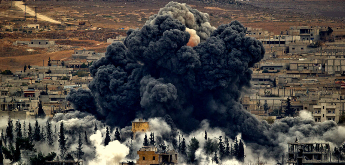 Smoke rises from the Syrian city of Kobani, following U.S. airstrikes outside Suruc, on the Turkey-Syria border, Nov. 17, 2014. (AP Photo)