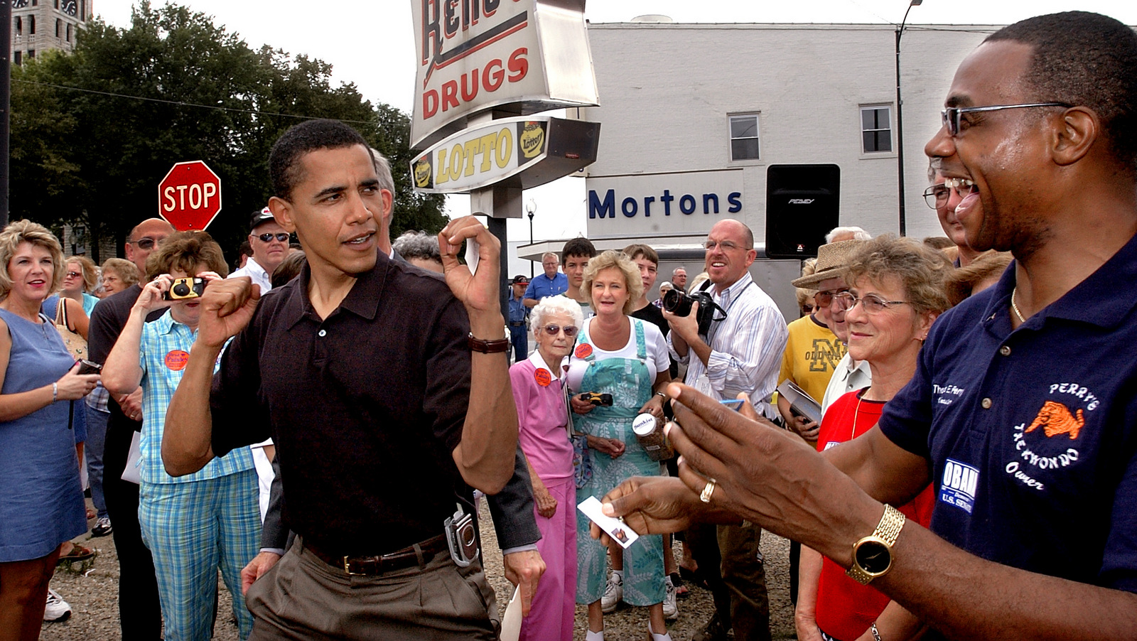 While surrounded by campaign supporters, Illinois Democratic candidate for U.S. Senate, Barack Obama, left, jokingly shows off his Tae Kwon-Do skills while attending a Christian County Democrats rally in Taylorville, Ill., Aug 4, 2004. (AP/Seth Perlman)